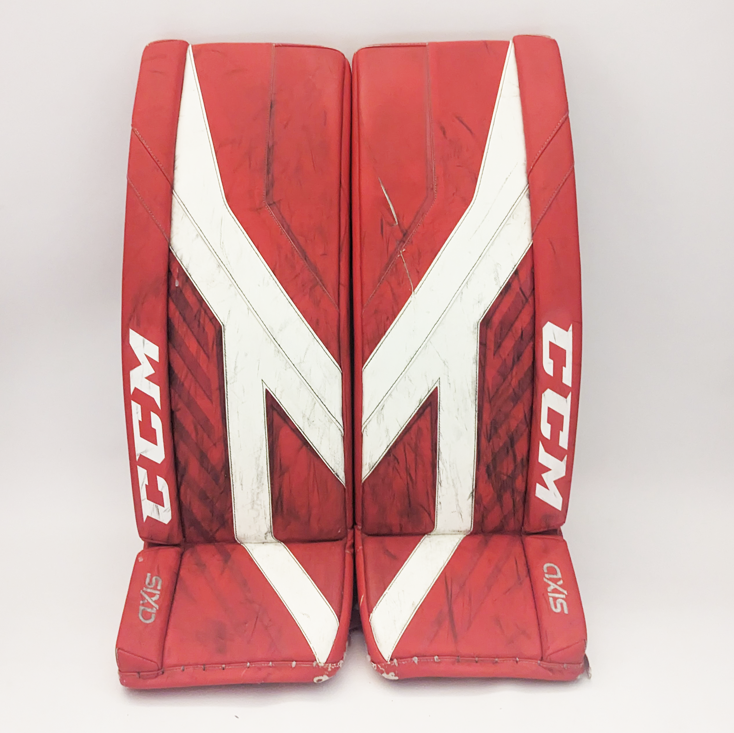 CCM AXIS - Jambières de gardien de but Pro Stock d'occasion (rouge/blanc)